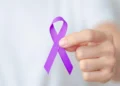 Unveiling the Cooktown 10 Model 10 Purple Ribbon Held By Hand