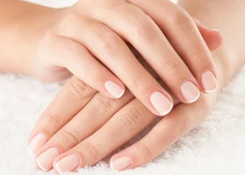 Female Hands Close Up Crossed On White Towel